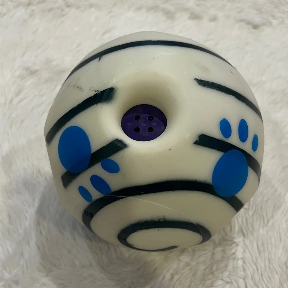 Slightly used Wobble Wag Giggle dog toy made of durable hard plastic.